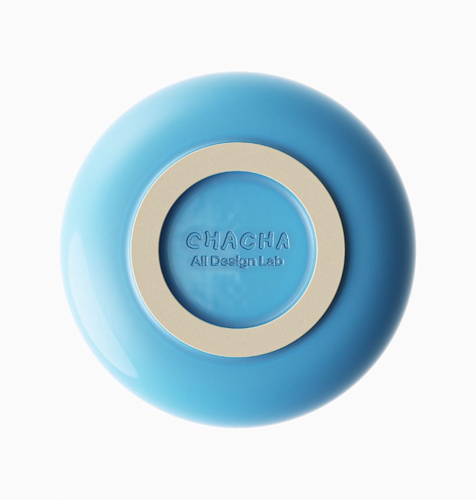 Bottom of a blue ceramic matcha bowl showing embossed Chacha All Design Lab branding.