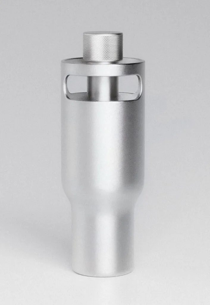 Metal water bottle with textured cap and integrated handles. Borrel Water Bottle by All Design Lab.