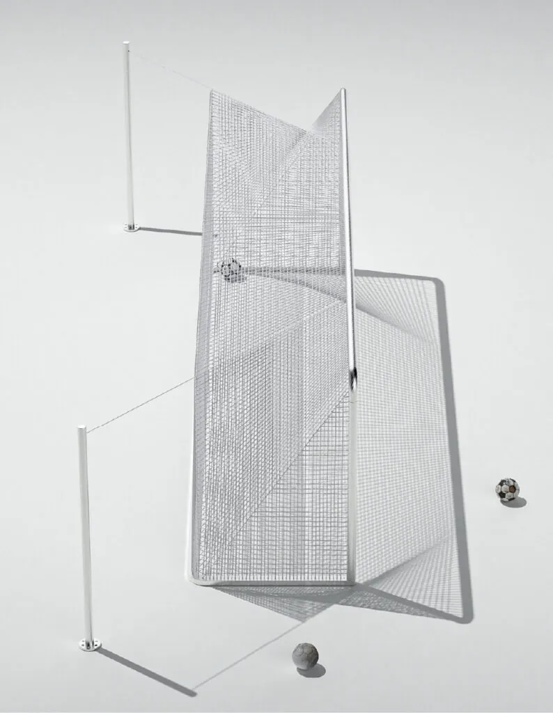 Soccer goal with net casting shadow on ground, two balls outside, minimalist design. Arc football goal post by All Design Lab.
