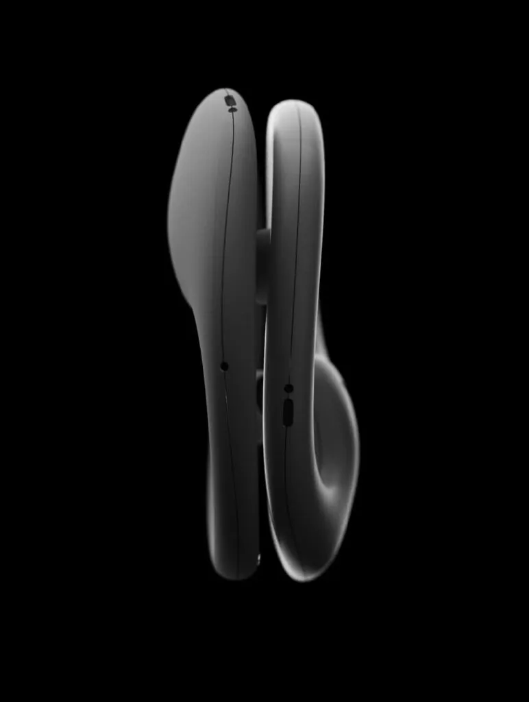 Silhouetted black earphones side by side against a dark background. Earbugs headphones by All Design Lab.