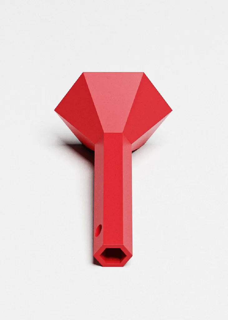 A red metal hexagonal shaped flashlight. Hex tools flashlight by All Design Lab.