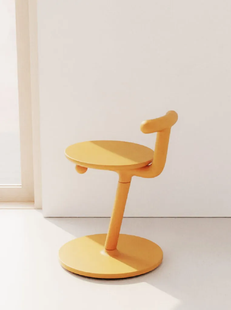 Yellow chair with a circular base, and sunlight shining through a window. Sit and Stir chair by All Design Lab.