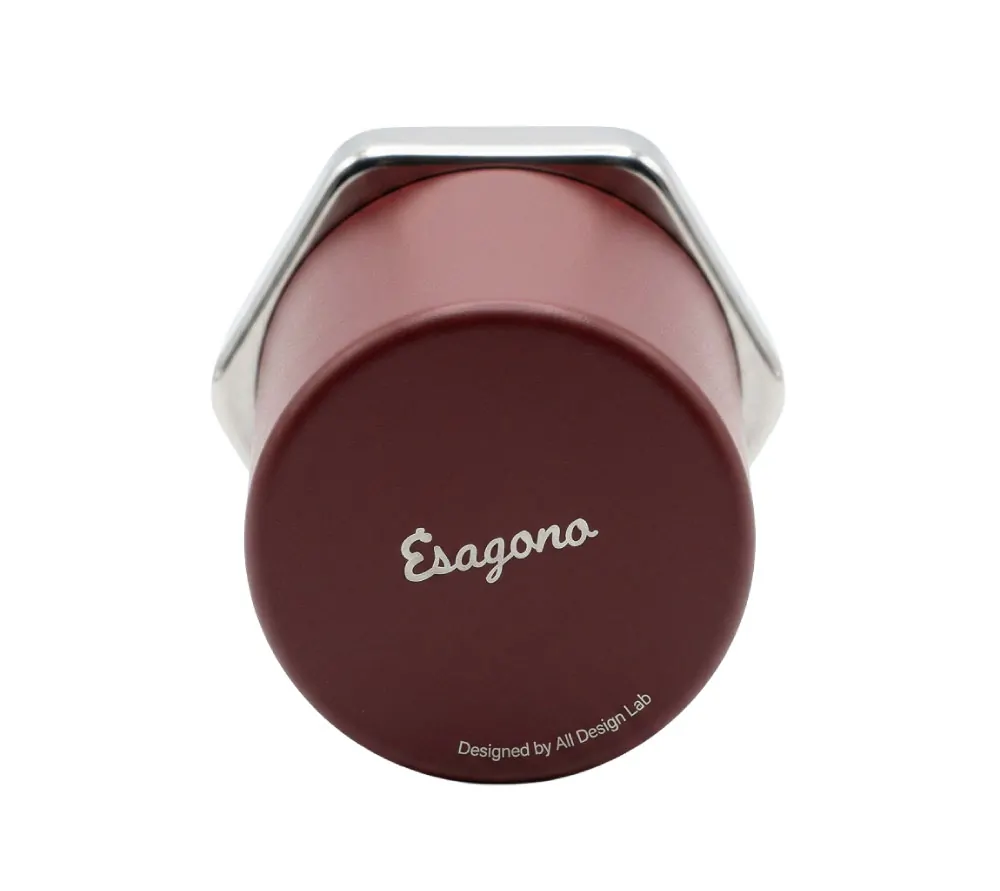 Bottom view of Esagono espresso cup in burgundy powder-coated aluminum, Esagono script wordmark and All Design Lab credit visible on base